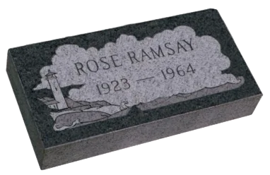 Flat granite memorial marker with a lighthouse engraving
